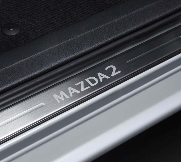 https://mazda-brochures.com/main/Mazda2/2023/1/de-at/assets/images/mazda2-scuff-plate-accessory-focus-4.jpg