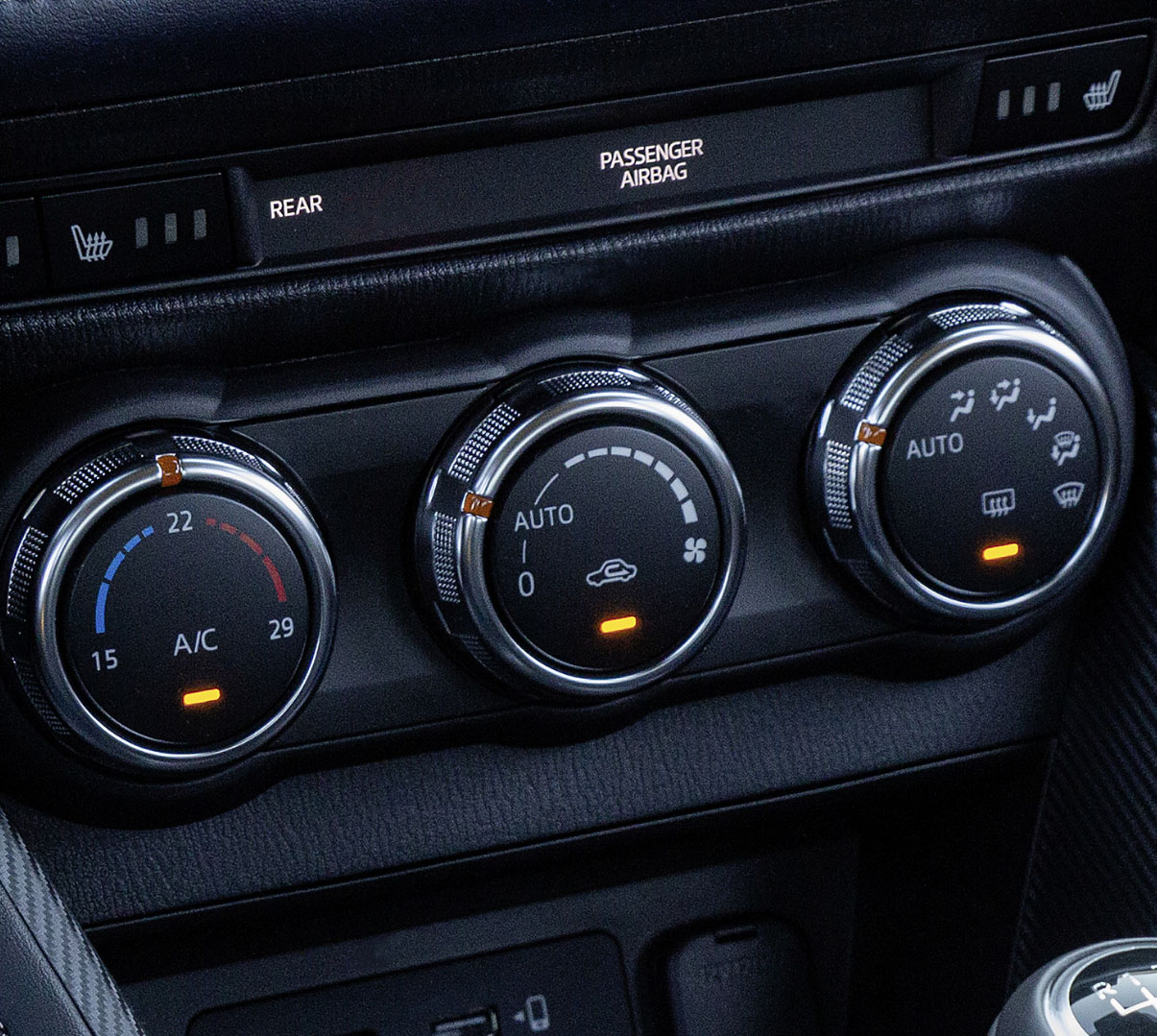 The round control dials of Mazda’s automatic air conditioning system.