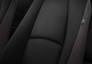 The Black Cloth interior with black dashboard insert of the Mazda2 Centre-Line grade