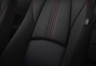 The Black Cloth Interior with red stitch of the Mazda2 Homura grade