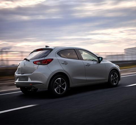 The flowing design and beautiful proportions of the Mazda2 in profile.