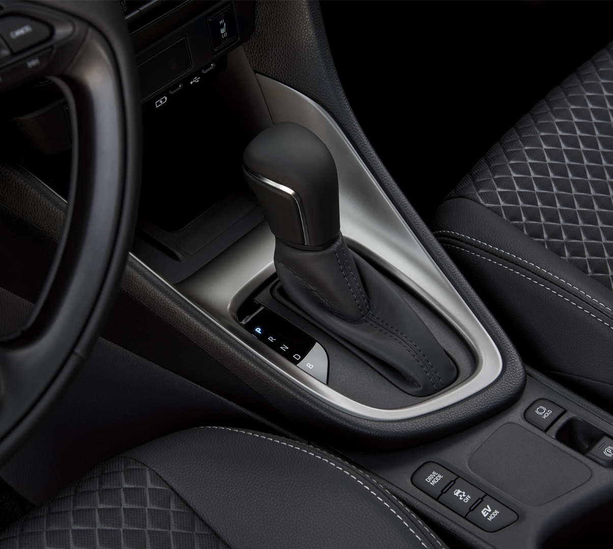 The standard leather-wrapped steering wheel of the Mazda2 Hybrid.