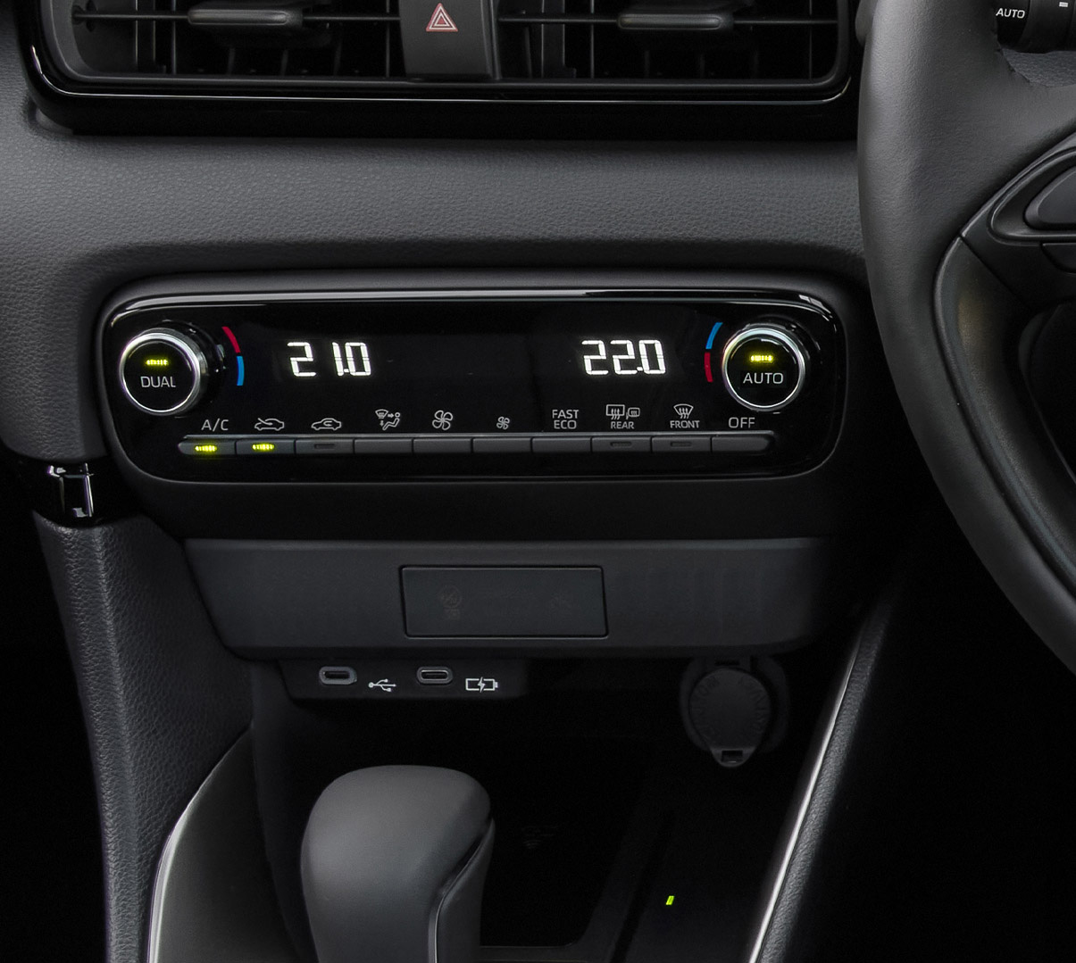 The dashboard and automatic climate controls of the Mazda2 Hybrid.