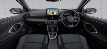 The interior of the Mazda2 Hybrid showing steering wheel and dashboard panel.