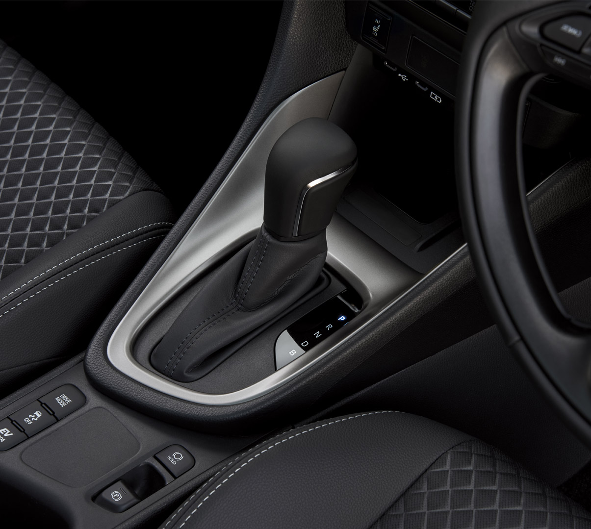 The standard leather-wrapped steering wheel of the Mazda2 Hybrid.