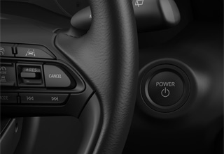 Push engine start button in the Mazda2 Hybrid Exclusive-Line trim level