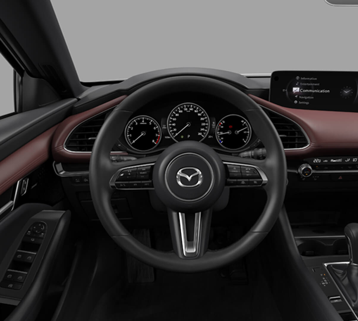 A close up of the steering wheel of the Madza 3 with all its beautiful details.