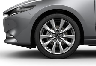 Jantes en alliage léger 18” en couleur argent sur la Mazda3 Sedan avec niveau de revêtement de siège Exclusive-Line