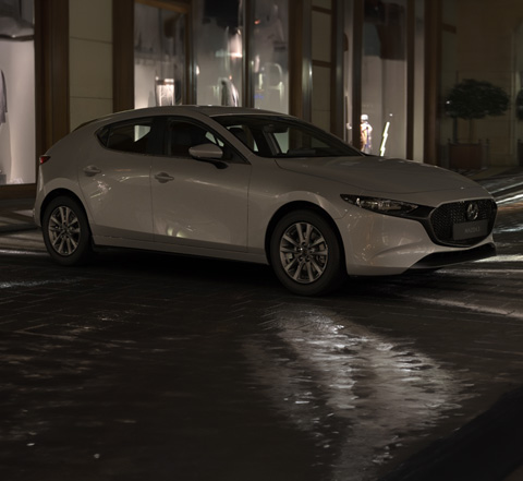 Profile view of the Mazda3 in Ceramic White