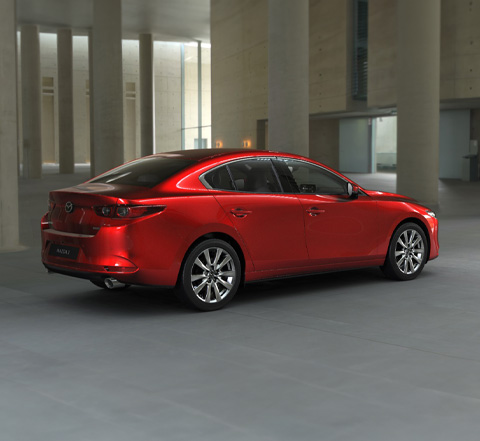 Profile view of the Mazda3 in Soul Red Crystal.