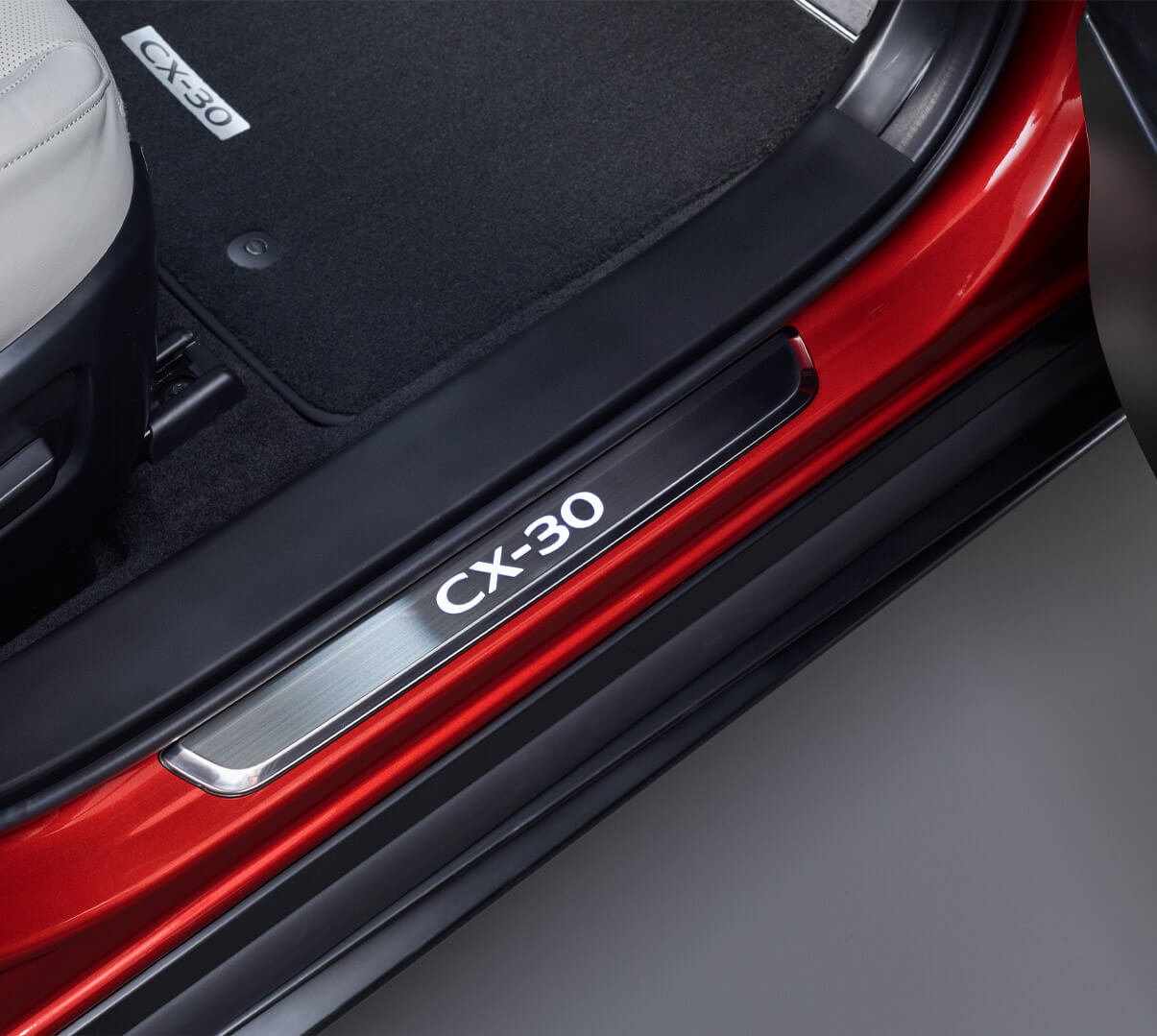 Stylish illuminated scuff plates for the Mazda CX-30.