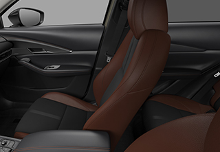 Black suede and terracotta leatherette seats of the Mazda CX-30 Nagisa trim level