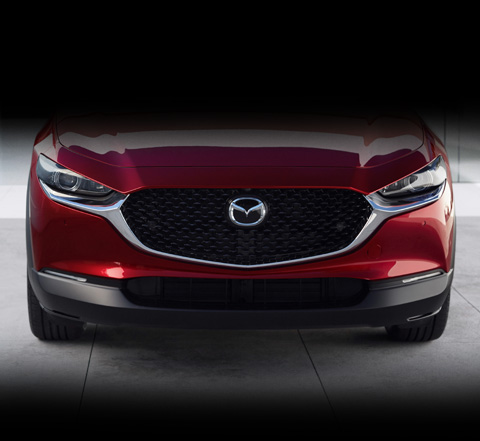 A close-up picture of the front grille of the Mazda CX-30