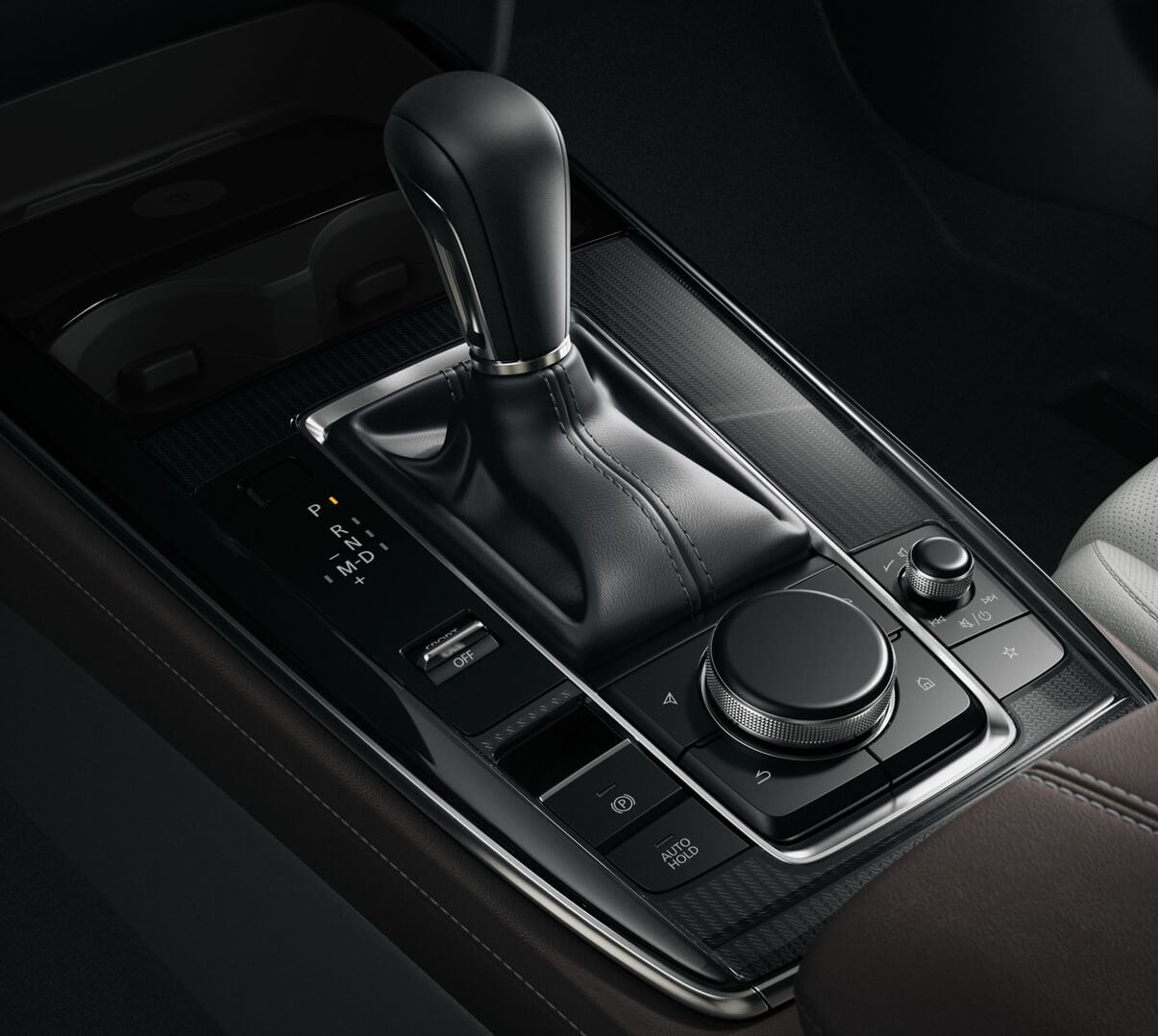 La console centrale de la Mazda CX-30 avec le levier de vitesse et le bouton du HMI Commander.