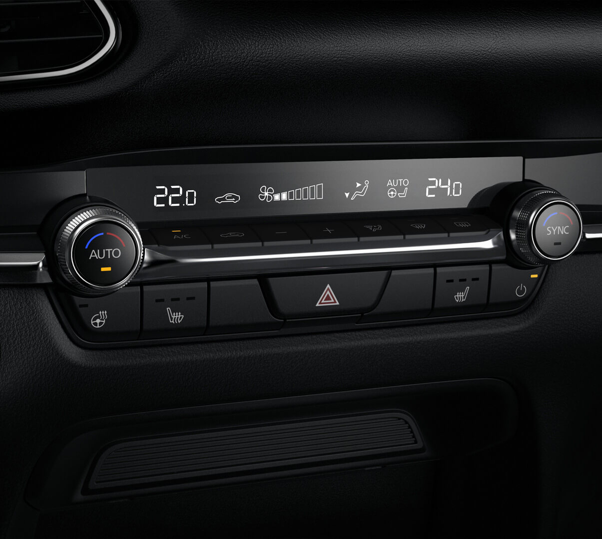 Les boutons de commande ronds du système de climatisation automatique de la Mazda CX-30.