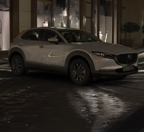 Profile view of the Mazda CX-30 in Ceramic White