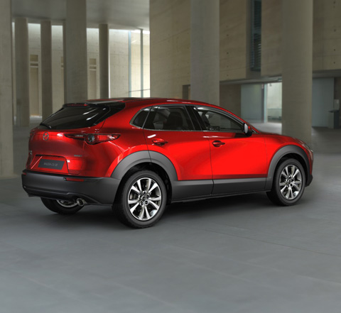 Profile view of the Mazda CX-30 in Soul Red Crystal.