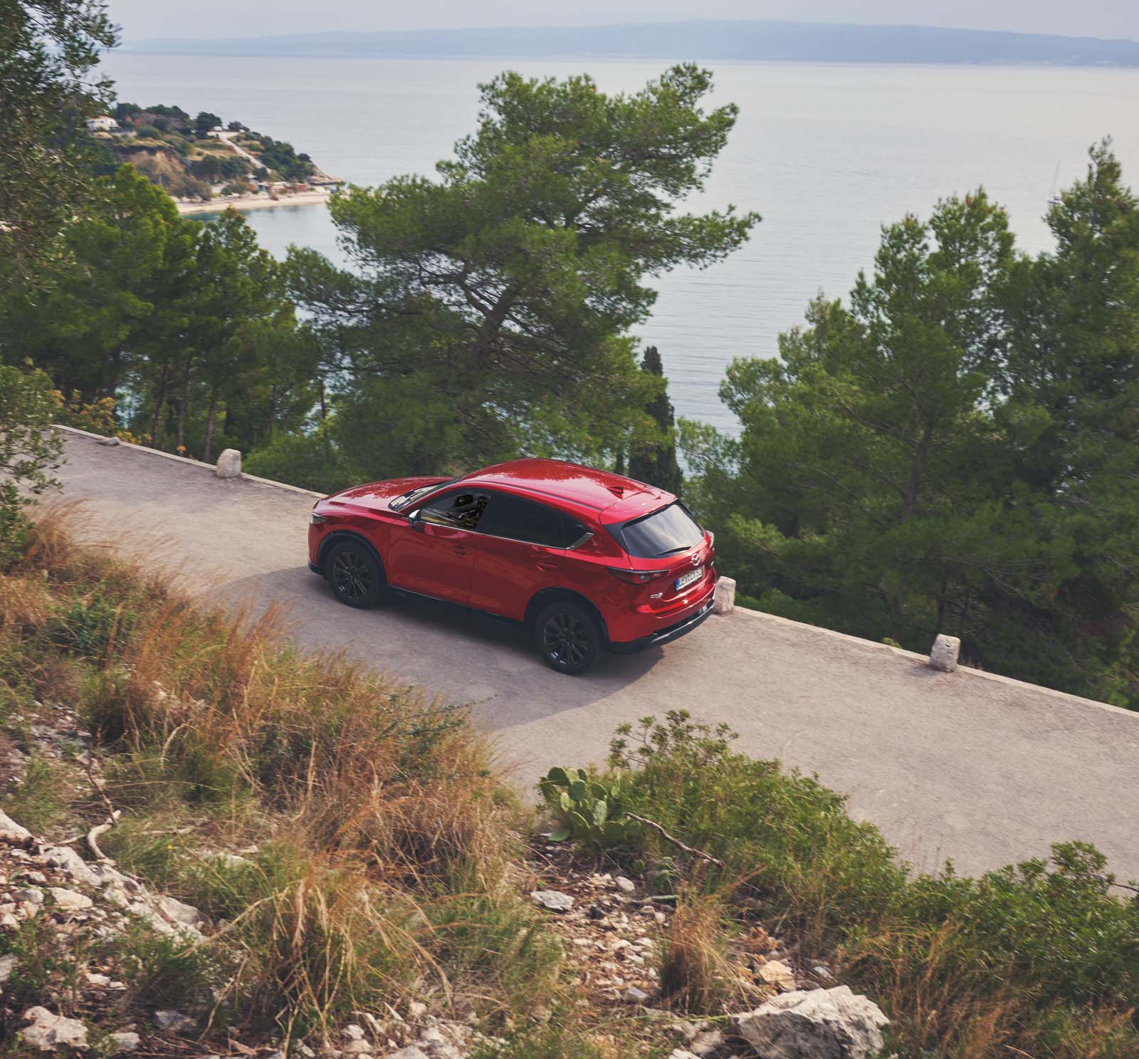 Red Mazda CX-5 shown from the rearside