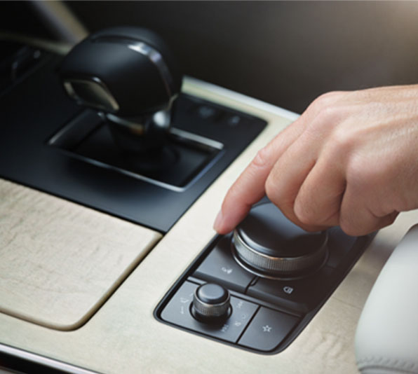 HMI Commander knob in the Mazda CX-60 on maple wood console