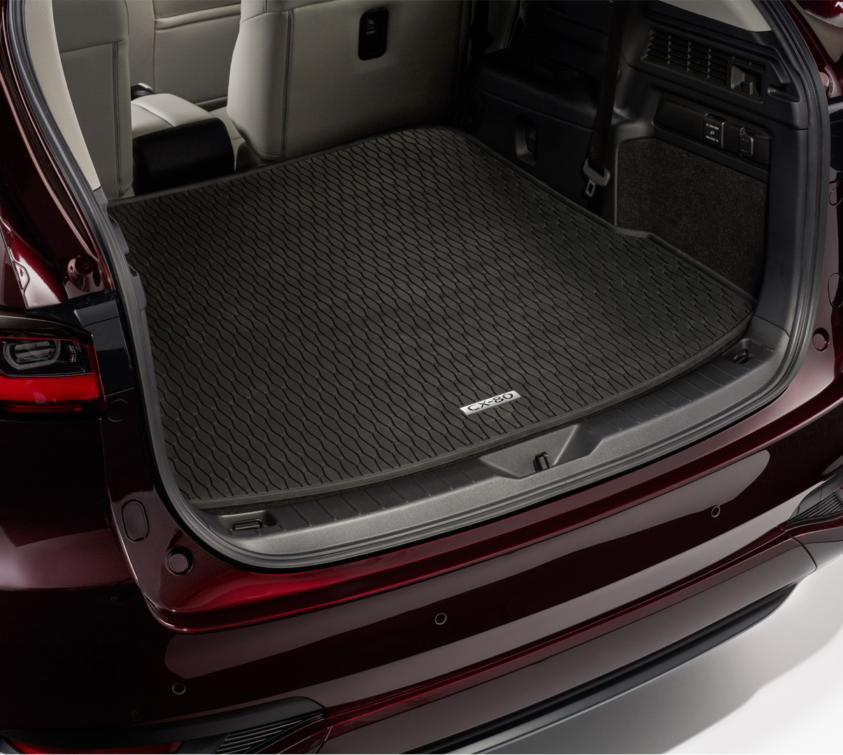 A trunk mat in the back of the Mazda CX-80.