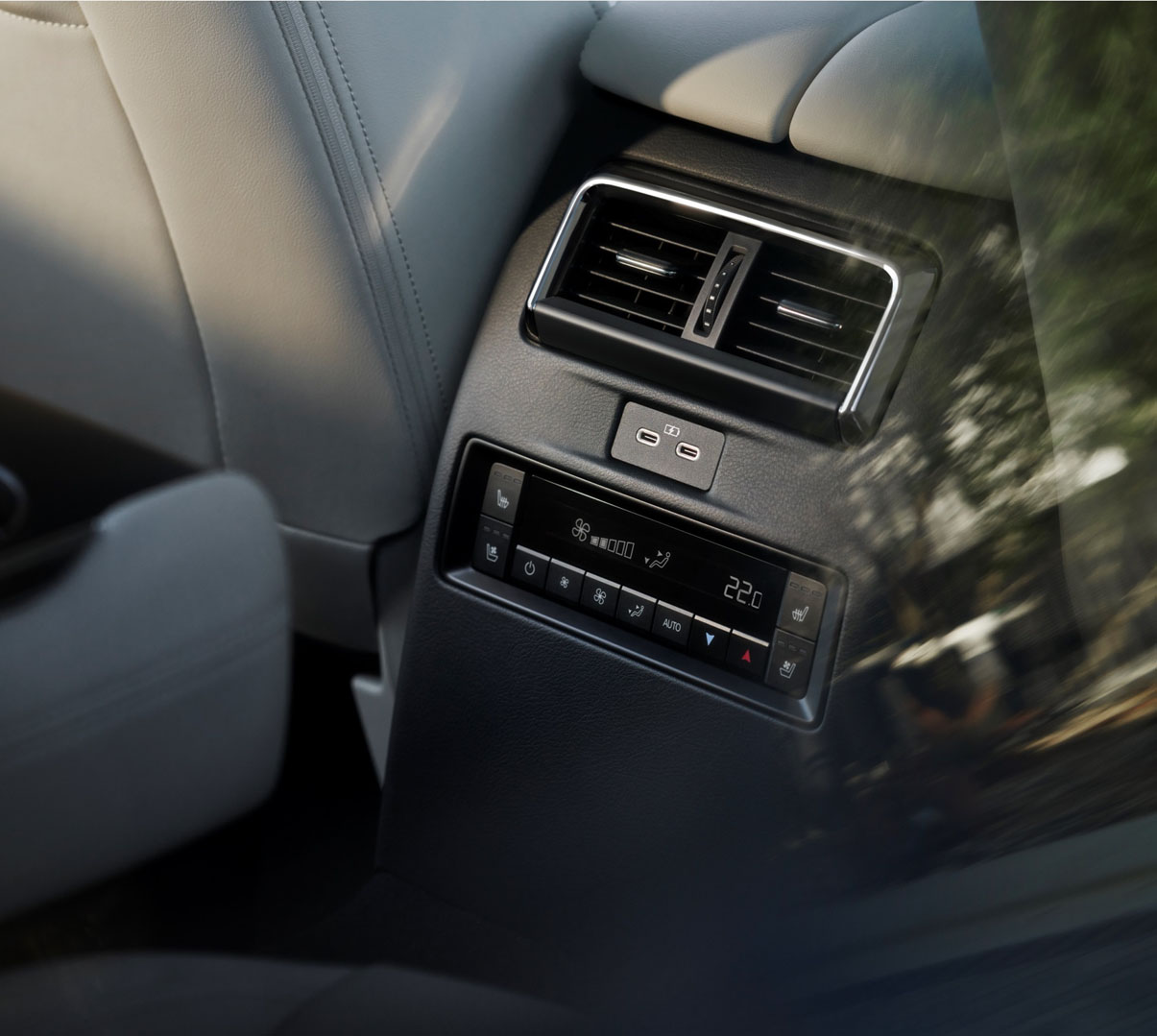 Detail of the Mazda CX-80's rear seats featuring climate control panel with silver accents.