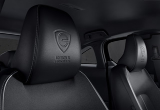 The Dark grey cloth with brown leatherette seats in the Mazda MX-30 Makoto grade.