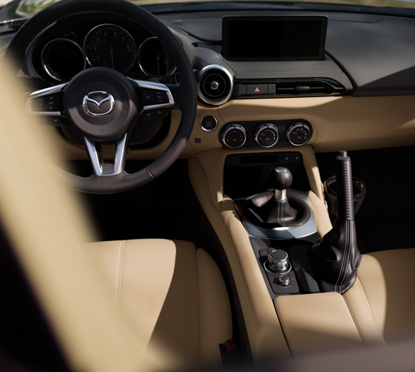 Interior of the Mazda MX-5 Roadster and the steering wheel.