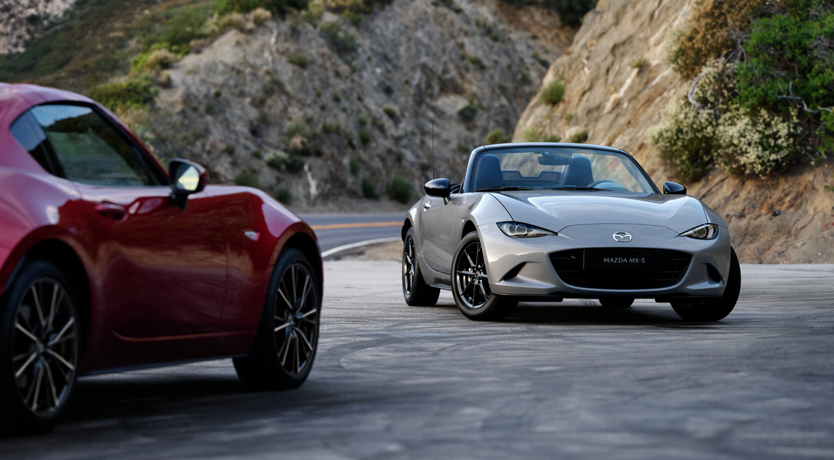 The Mazda MX-5 Roadster and the Mazda MX-5 RF parked in front of each other.