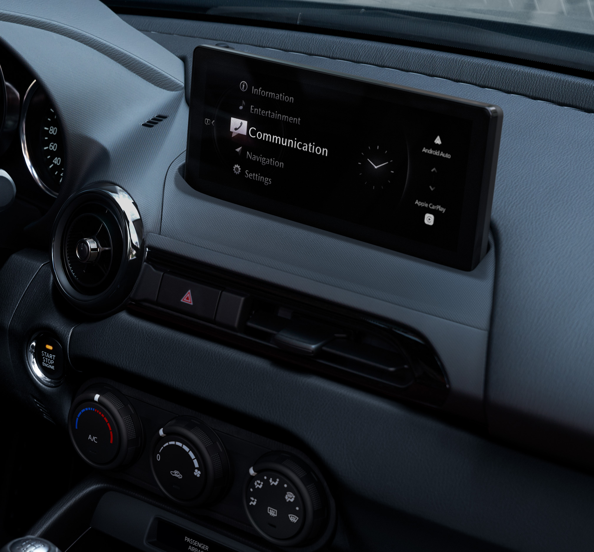 The interior of the Mazda MX-5 Roadster and the new 8.8-inch centre touchscreen.