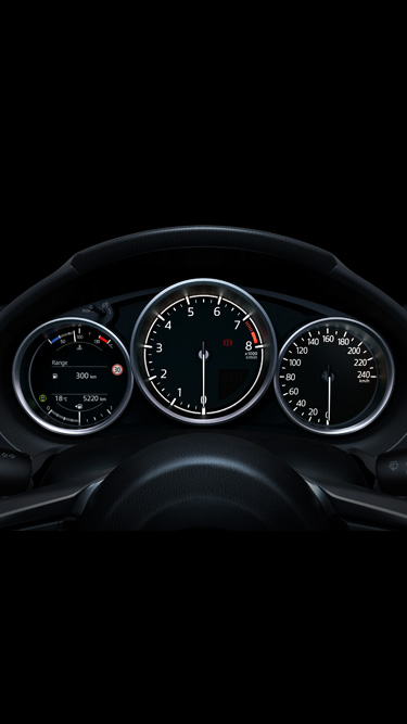 The instrument panel inside the Mazda MX-5's cockpit.