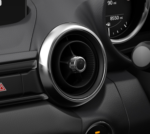 The dashboard with chrome air vents in Mazda MX-5
 Roadster.