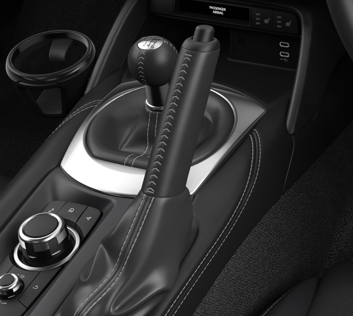 The standard leather covered shifter of the Mazda MX-5
 Roadster.