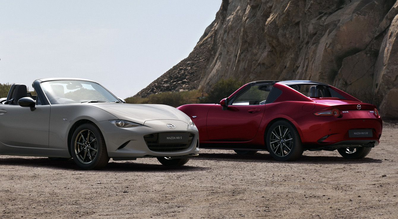 The Mazda MX-5
 Roadster and the Mazda MX-5
 RF parked in front of each other.