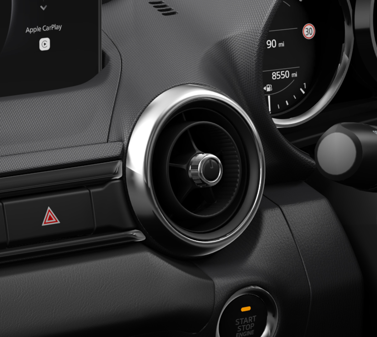 The dashboard with chrome air vents in Mazda MX-5
 Roadster.