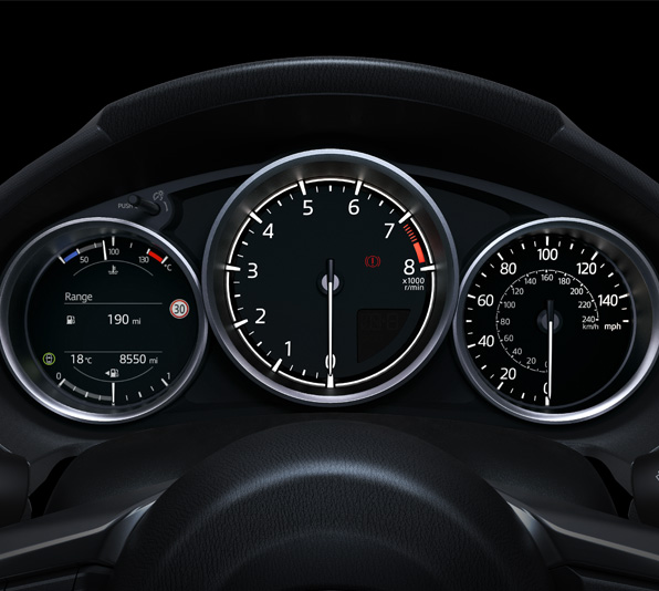 The dashboard with gauges and speedometer of the Mazda MX-5
 Roadster.