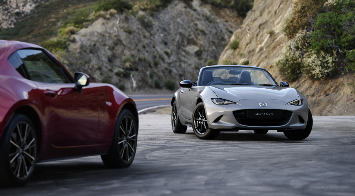 The Mazda MX-5
 Roadster and the Mazda MX-5
 RF parked in front of each other.