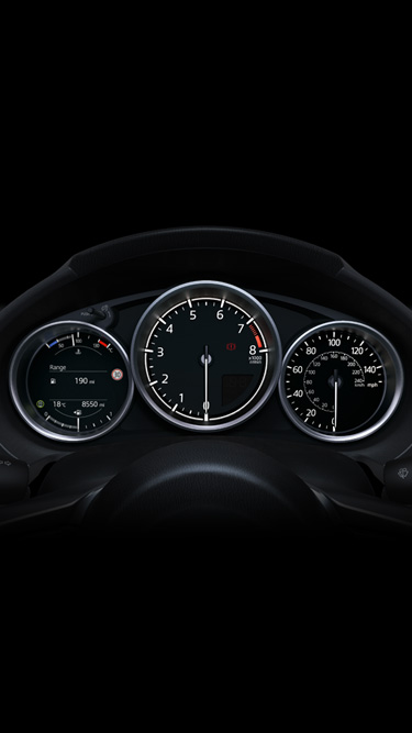 The instrument panel inside the Mazda MX-5
's cockpit.