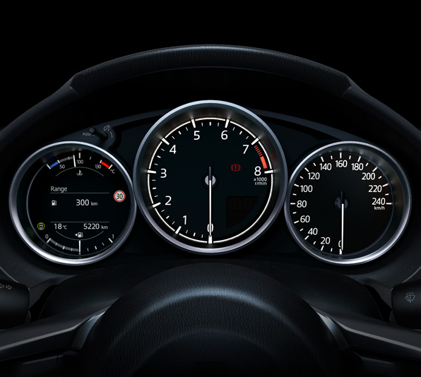 The dashboard with gauges and speedometer of the Mazda MX-5 Roadster.