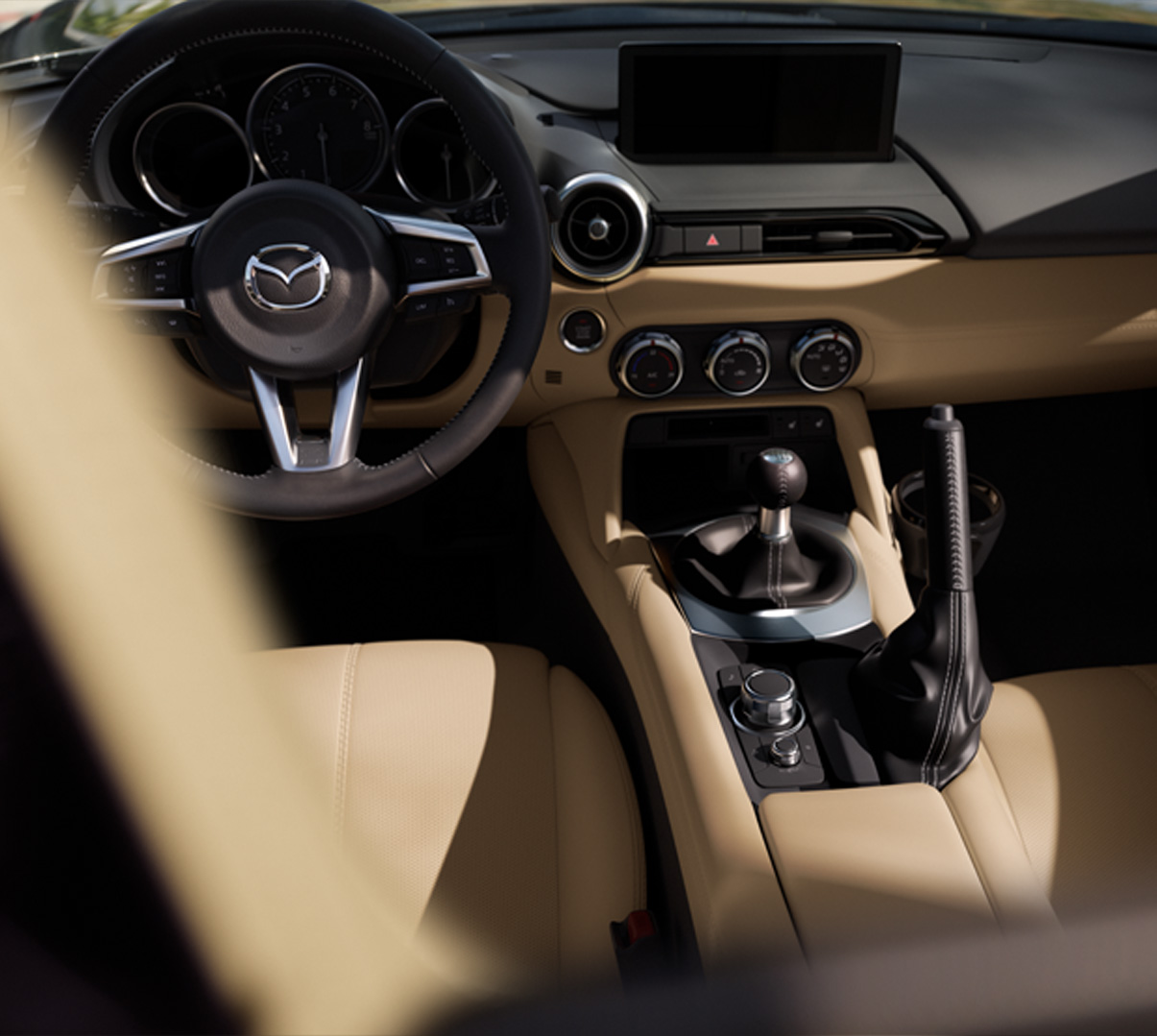 Interior of the Mazda MX-5 Roadster and the steering wheel.