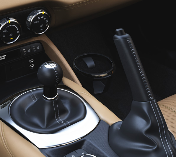 De standaard met leder beklede versnellingspook van de Mazda MX-5
 Roadster.